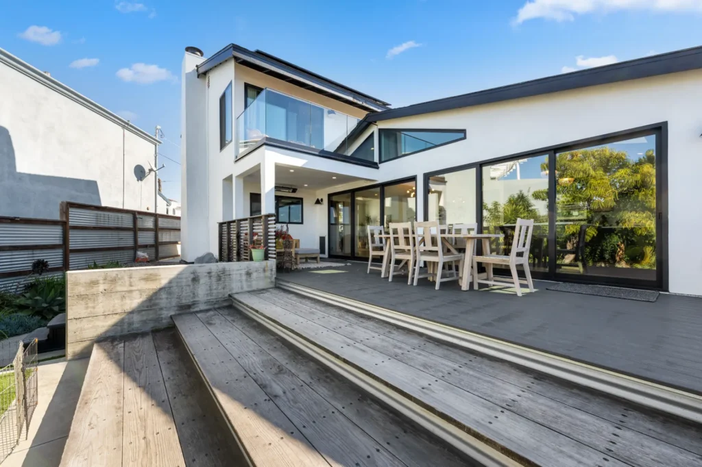 DSC 8152 | Home Remodeling, Home Construction | Horizon Remodeling and Construction Modern home exterior with sliding glass doors opening onto a raised deck