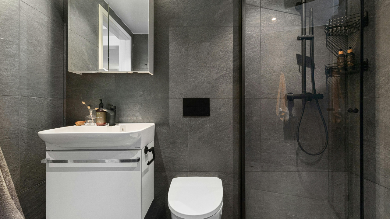 Floor-To-Ceiling Storage Walls Showcase Vertical Interior Remodeling For Small Spaces